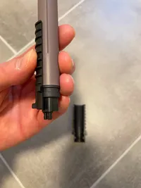 One half of the Ritchey Battery Mount surrounding the battery