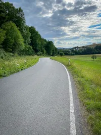 A curvy road winding down