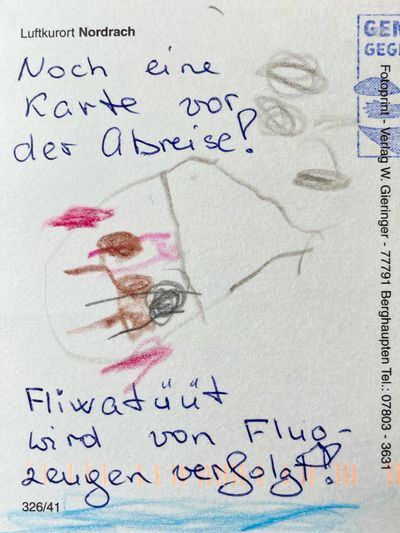 A postcard with a hand drawing of a fliewatuut and a handwritten greeting, explaining the fliewatuut is getting chased by airplanes.