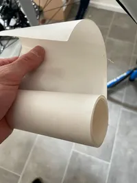 A hand holding the 3M Film role	