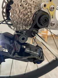 A hex key screwing in the attach-screw to mount the rear derailleur