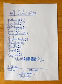 A handwritten school report.
