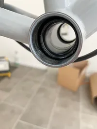 A view into the bottom bracket shell with the BB1 plastic cover inserted